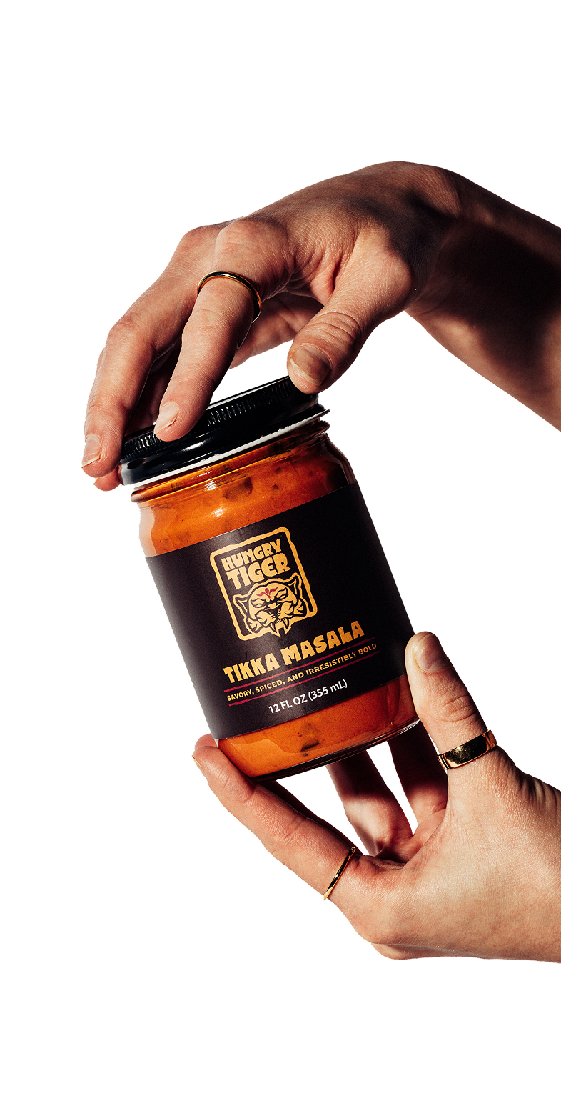 Hungry Tiger Jar, photo with hands, avif
